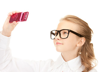 Image showing happy girl taking picture with cell phone