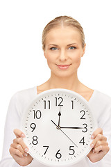 Image showing woman holding big clock