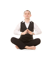 Image showing businessman sitting in lotus pose