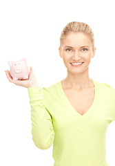 Image showing woman with piggy bank