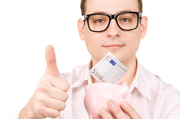 Image showing businessman with piggy bank and money