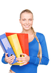 Image showing young attractive businesswoman with folders