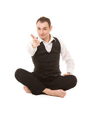 Image showing businessman sitting in lotus pose