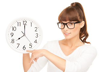 Image showing woman holding big clock