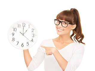 Image showing woman holding big clock