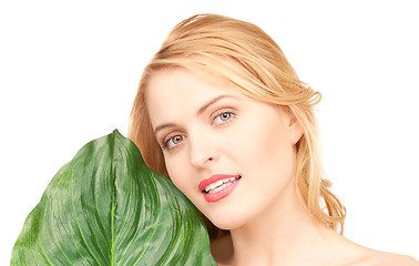 Image showing woman with green leaf over white