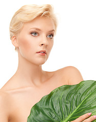Image showing woman with green leaf