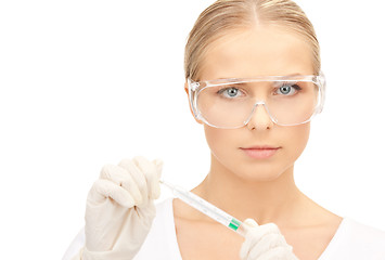 Image showing attractive female doctor with thermometer