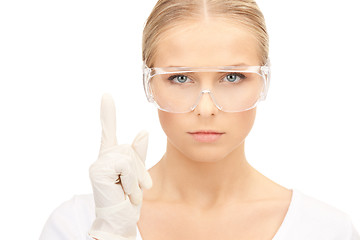 Image showing woman in protective glasses and gloves