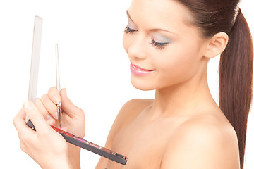 Image showing lovely woman with palette and brush