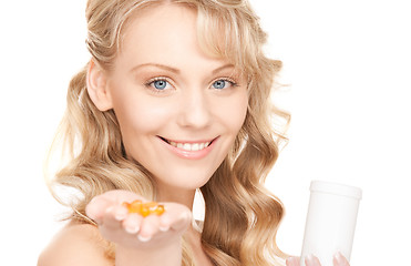 Image showing young woman with pills