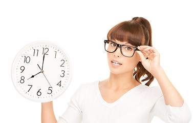 Image showing woman holding big clock