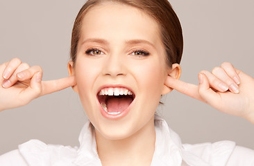 Image showing woman with fingers in ears