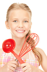 Image showing little housewife with red ladle