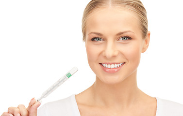 Image showing attractive female doctor with thermometer