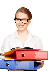 Image showing young attractive businesswoman with folders