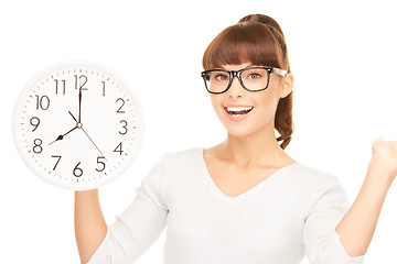 Image showing woman holding big clock