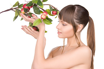 Image showing lovely woman with apple twig