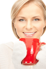 Image showing beautiful woman with red mug