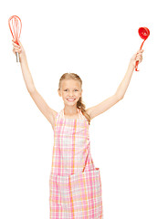 Image showing little housewife with red ladle