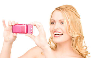 Image showing happy woman using phone camera