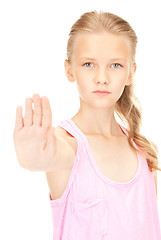 Image showing lovely girl showing stop sign