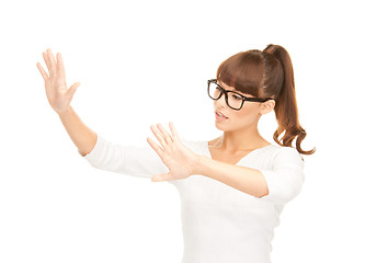 Image showing businesswoman working with something imaginary