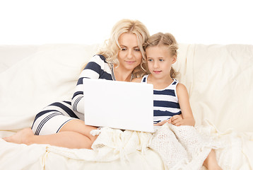 Image showing happy mother and child with laptop computer