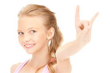 Image showing happy girl showing devil horns gesture