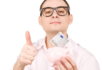 Image showing businessman with piggy bank and money