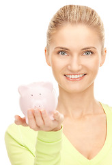 Image showing woman with piggy bank