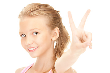 Image showing lovely girl showing victory sign