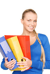 Image showing young attractive businesswoman with folders