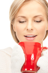 Image showing beautiful woman with red mug