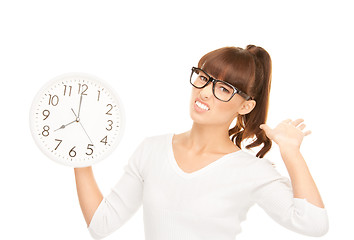 Image showing woman holding big clock