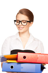 Image showing young attractive businesswoman with folders