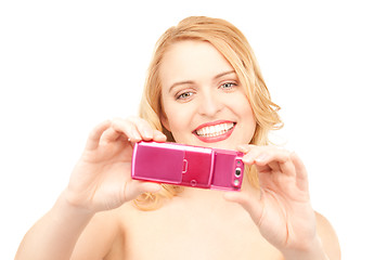 Image showing happy woman using phone camera