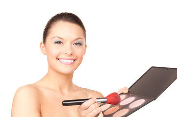 Image showing lovely woman with palette and brush