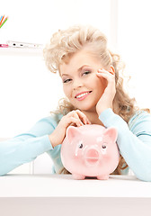 Image showing lovely woman with piggy bank