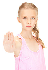 Image showing lovely girl showing stop sign