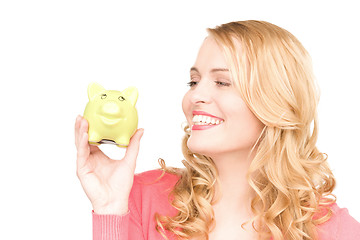 Image showing lovely woman with piggy bank