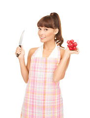 Image showing housewife with big knife and radish
