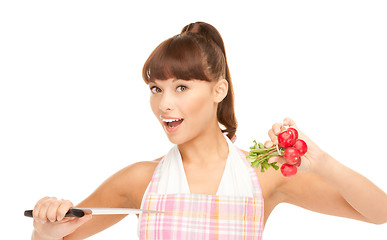 Image showing housewife with big knife and radish