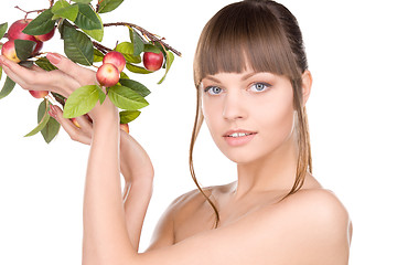 Image showing lovely woman with apple twig