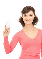 Image showing woman holding energy saving bulb