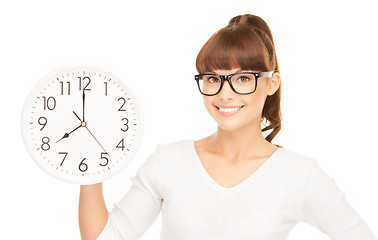 Image showing woman holding big clock