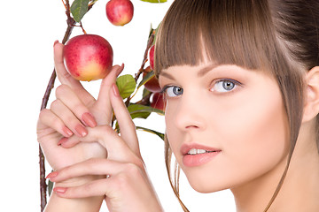 Image showing lovely woman with apple twig