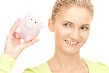 Image showing woman with piggy bank