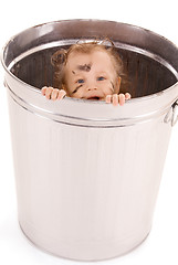 Image showing baby in trash can