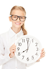 Image showing girl holding big clock